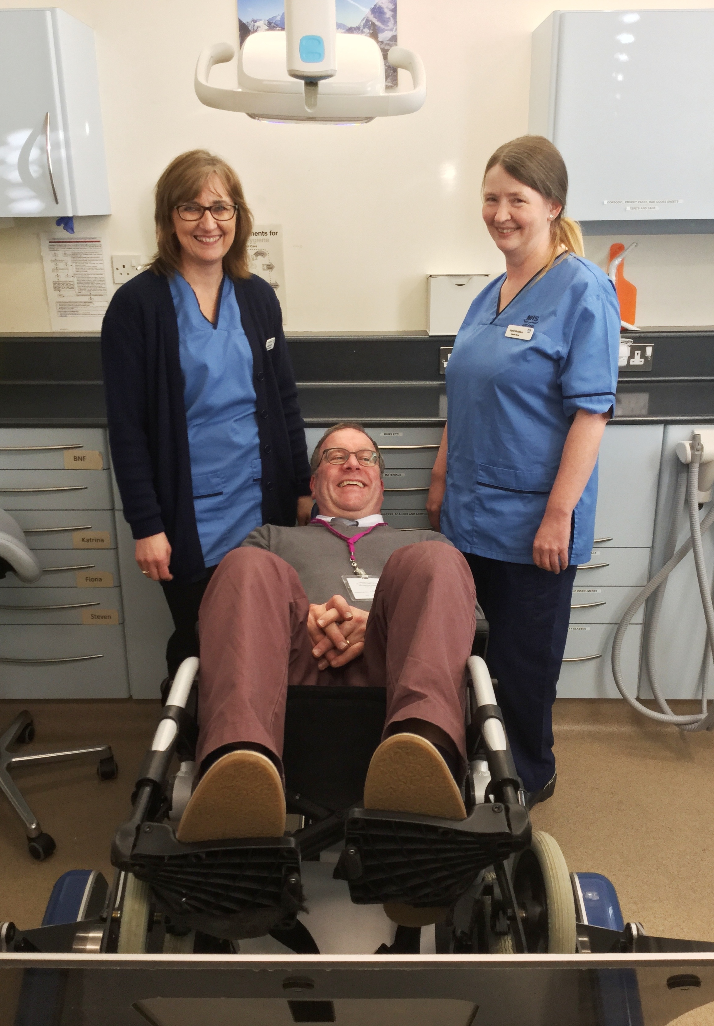 Dental staff with the wheelchair tipper